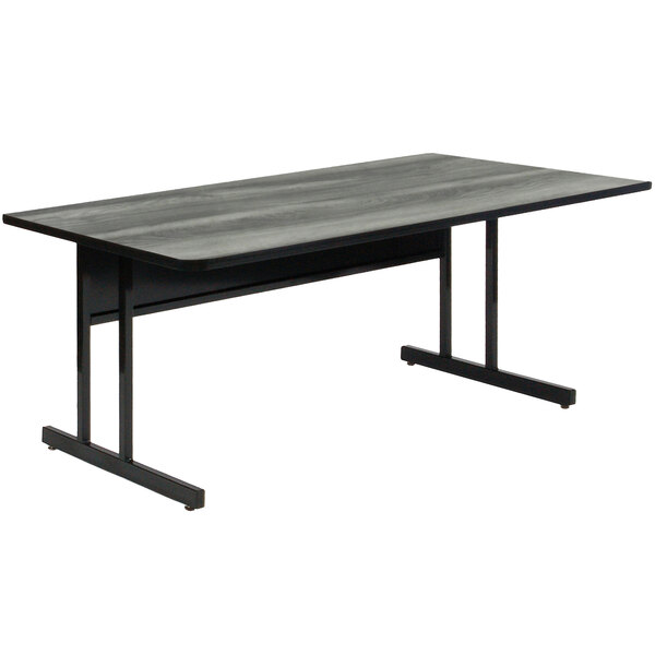 A black table with metal legs and a gray top.