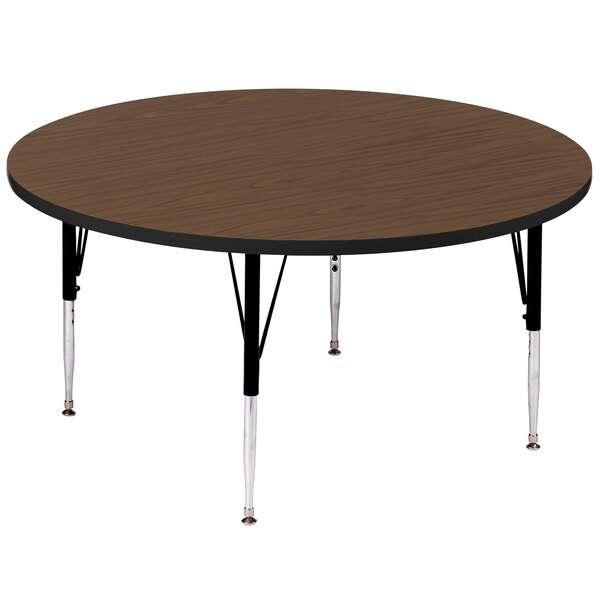 A Correll round walnut activity table with black metal legs.