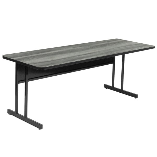 A black and gray Correll rectangular desk with a metal frame.