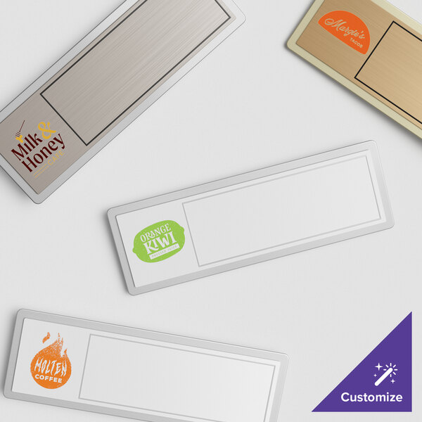 A group of rectangular Cawley metal nametags with white borders.