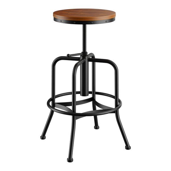 A Lancaster Table & Seating black and wood bar stool with a wooden seat and a metal base.