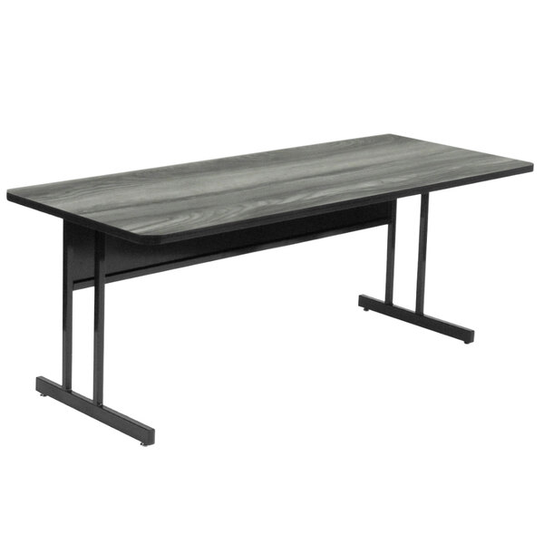 A black and gray Correll rectangular desk with a metal frame.