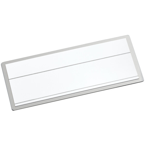 A white rectangular object with a silver border.