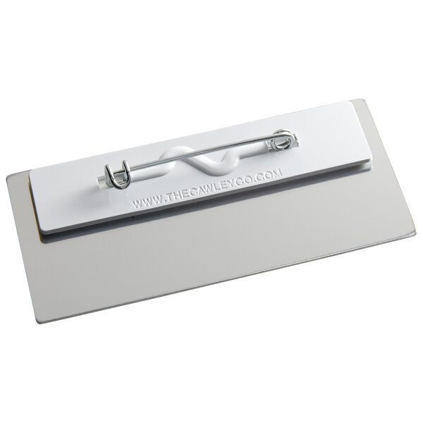 A white rectangular Cawley metal nametag with a metal clip.