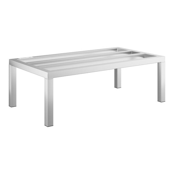 A white table with a metal shelf.