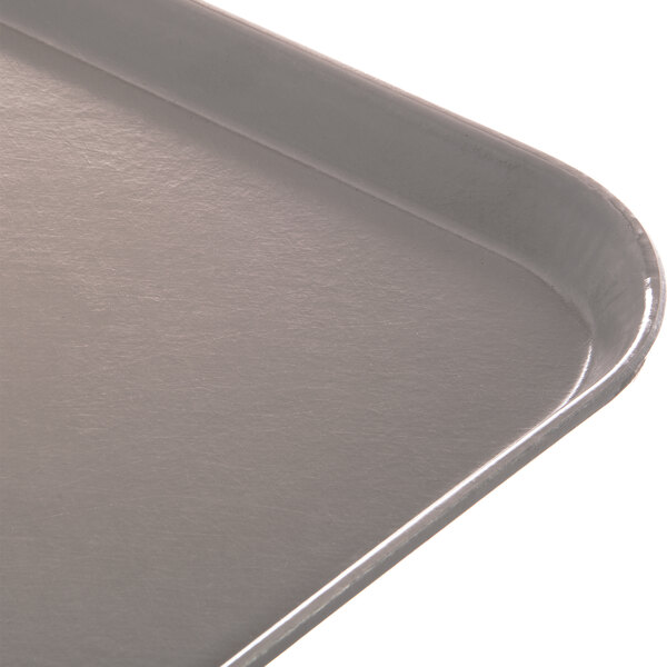 A close up of a Dinex Glasteel fiberglass tray with a latte surface.