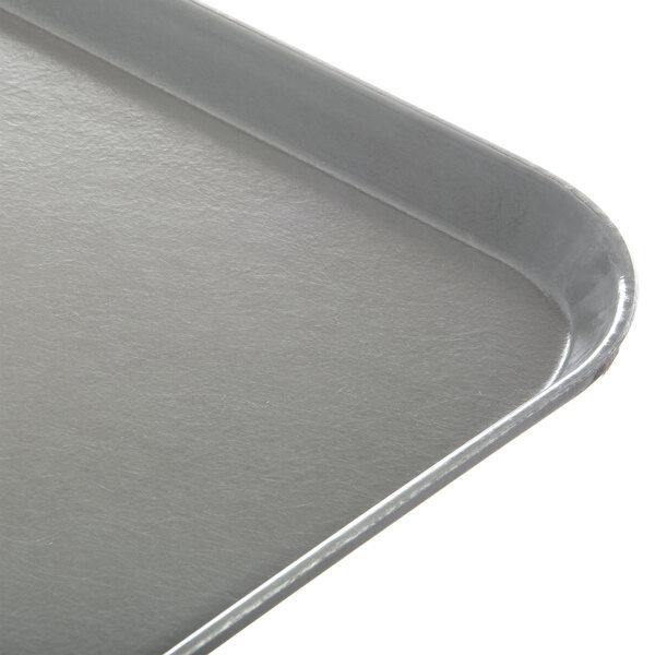A close up of a gray Dinex fiberglass tray.