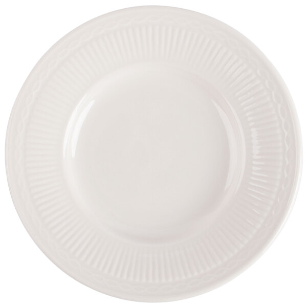 An ivory china bread and butter plate with an embossed circular pattern.
