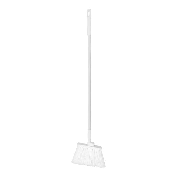 a white broom with a handle