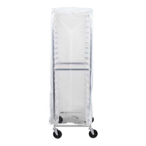 A tall, wheeled rack is covered by a clear plastic cover, revealing the rack's shelves and structure inside.