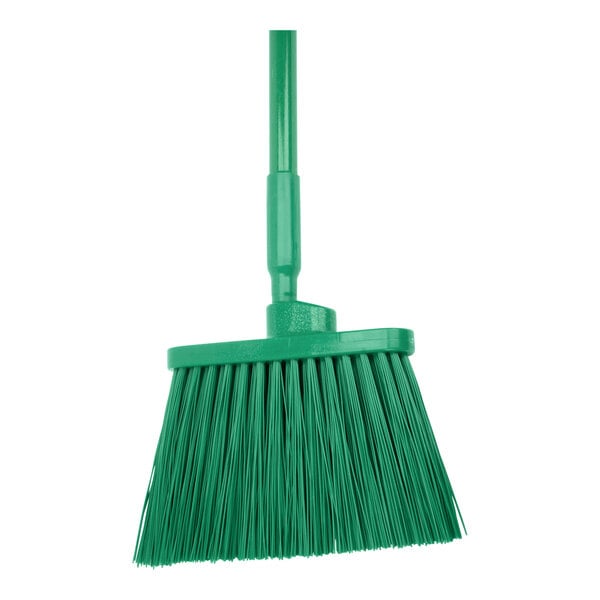 A green broom with a long handle.