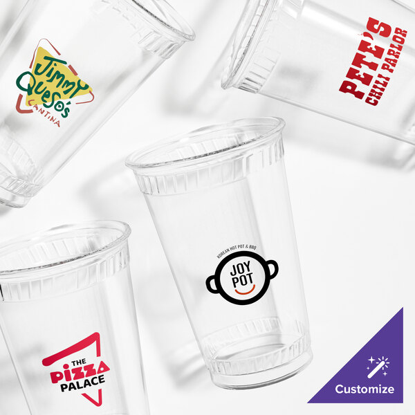 A group of clear Fabri-Kal Greenware plastic cups with a logo on one.