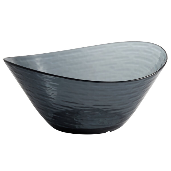 A Libbey Infinium oval bowl in Storm with a wavy design.