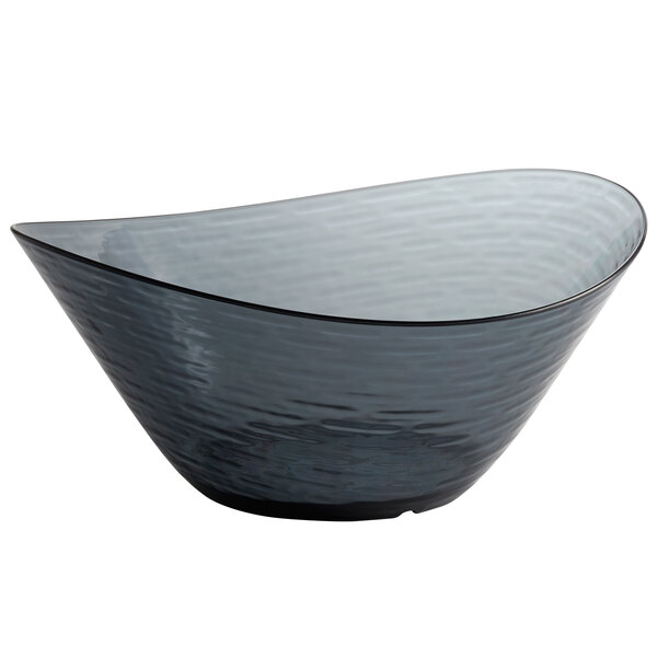 A close-up of a Libbey Tritan plastic oval bowl with a curved edge.