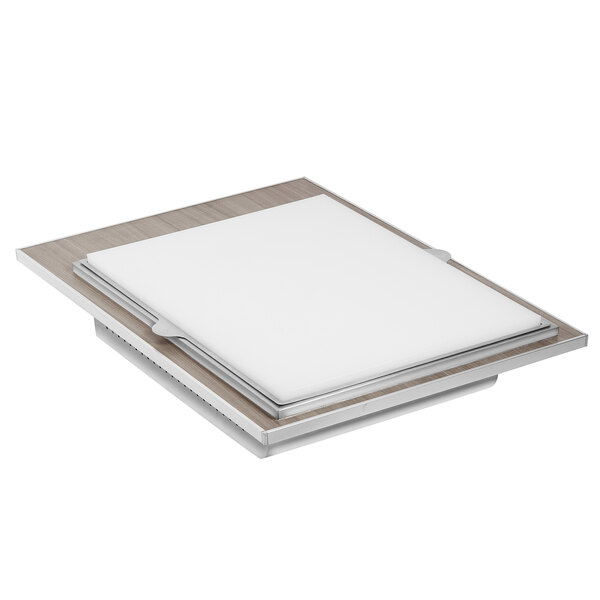 A grey grain rectangular drop-in cutting board tile on a wood surface.