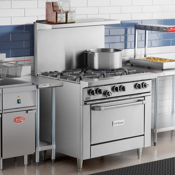 A U.S. Range commercial gas range with a standard oven on a counter in a commercial kitchen.