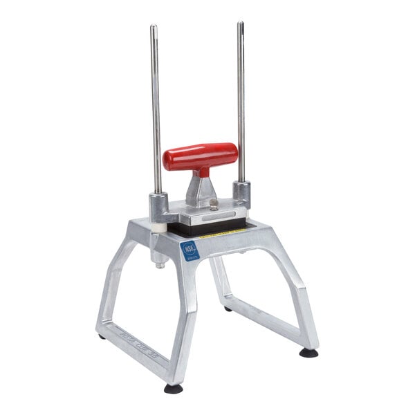 A tabletop-mounted fruit and vegetable dicer with a red handle and metal frame.