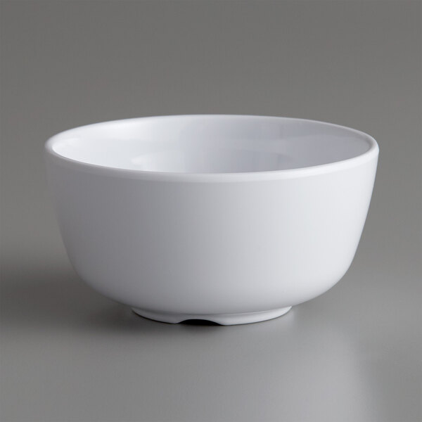 a white bowl on a gray surface