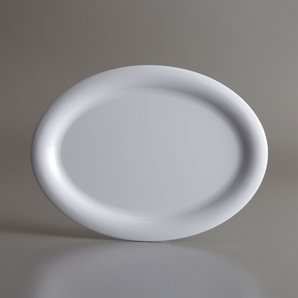 An American Metalcraft white oval melamine platter on a gray background.