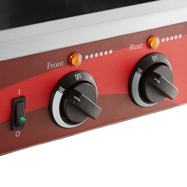 An Avantco commercial hot dog roller grill on a counter in a professional kitchen.