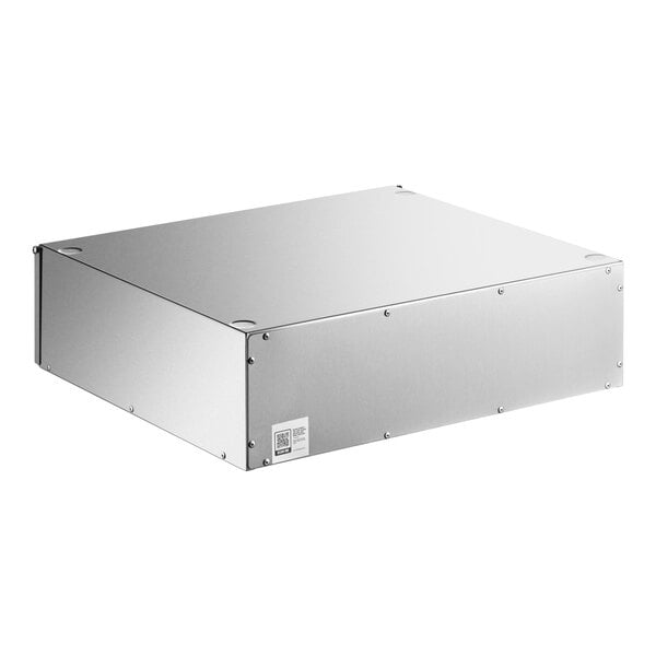 A rectangular stainless steel box with visible screws and a small label on the front corner.