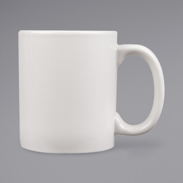 A white Tuxton china mug with a C-handle.