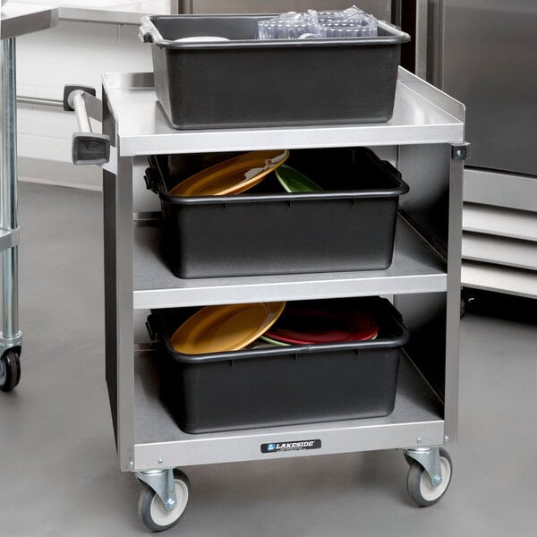 A Lakeside stainless steel utility cart with black laminate shelves.