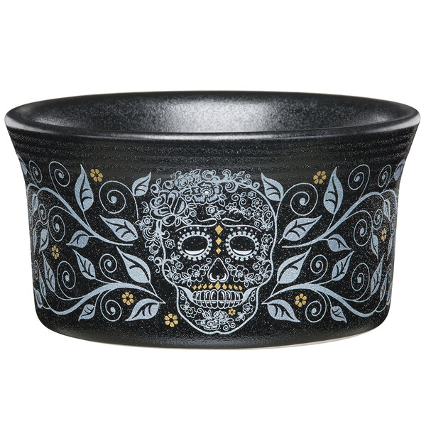 A black Fiesta ramekin with a skull design on it.