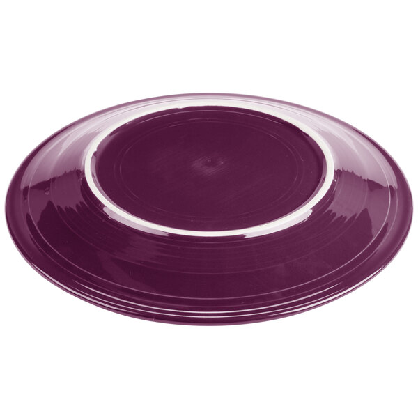 A purple plate with a white rim.
