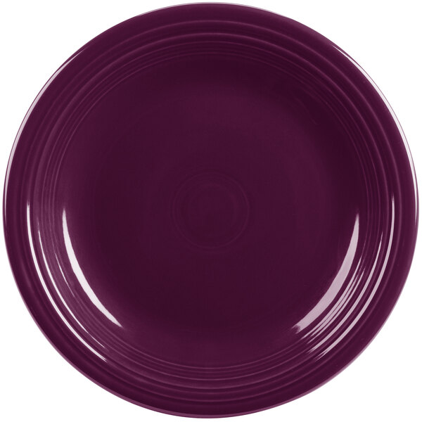 A close-up of a purple Fiesta® dinner plate with a rim.
