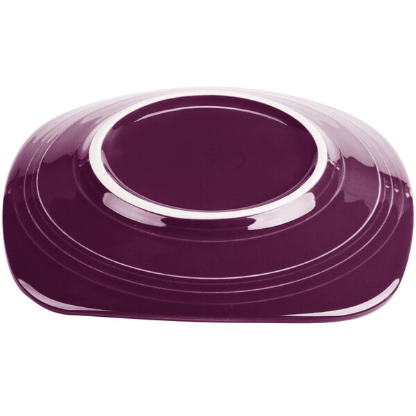 A mulberry Fiesta® luncheon plate with a white rim.