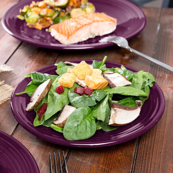 A Mulberry Fiesta luncheon plate with salad and fish on it.