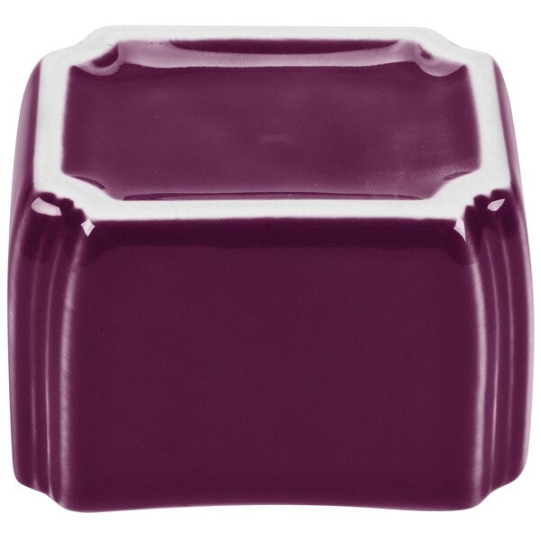 A purple square ceramic sugar caddy with a white border.
