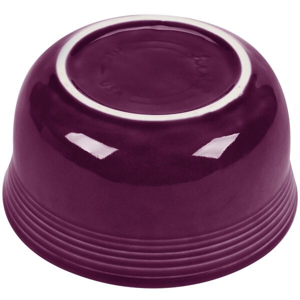 A mulberry Fiesta china bowl with a white rim.