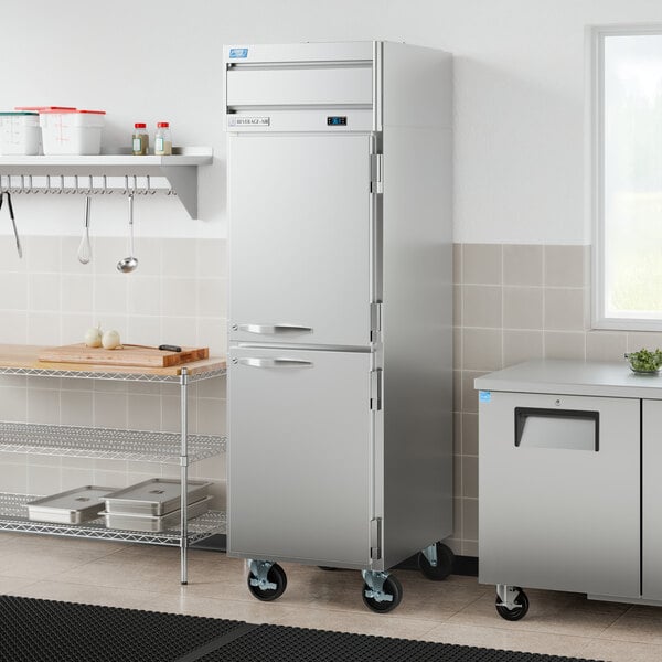 A stainless steel, single-section convertible reach-in refrigerator and freezer with half doors on casters.
