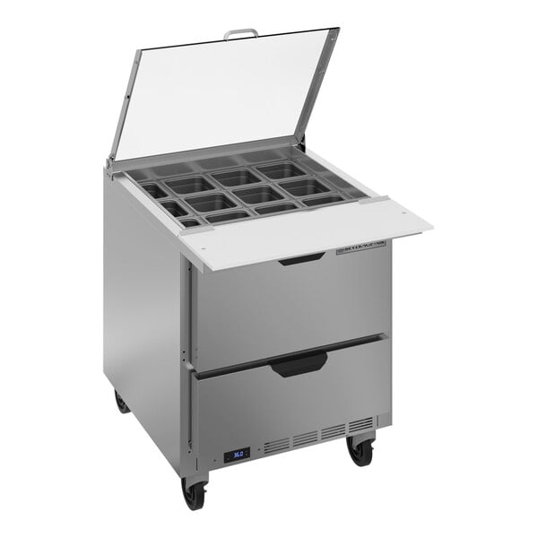 A Beverage-Air stainless steel refrigerated sandwich prep table with two drawers and a clear lid open.