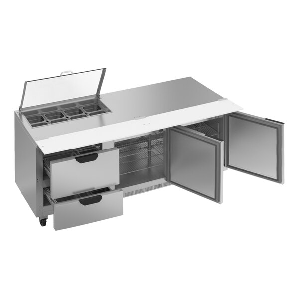 A stainless steel Beverage-Air sandwich prep table with two drawers and clear lids on a stainless steel counter.