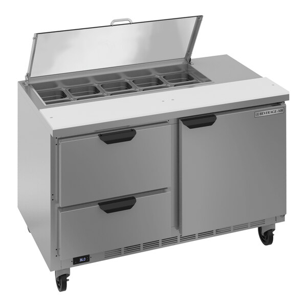 A Beverage-Air stainless steel refrigerated sandwich prep table with drawers and clear lids.