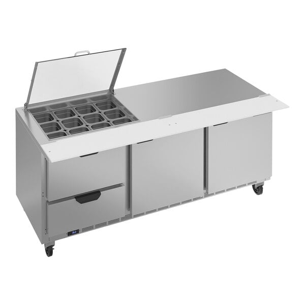 A Beverage-Air stainless steel refrigerated sandwich prep table with drawers and clear lids.