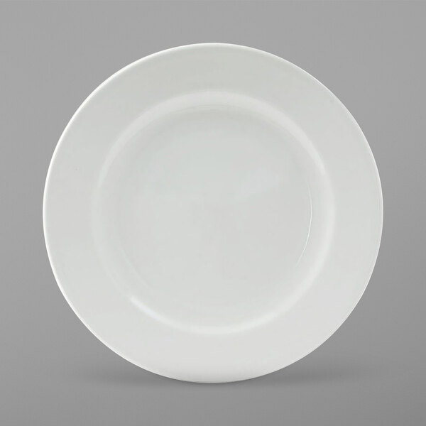 A Tuxton Alaska bright white china plate with a wide white rim.