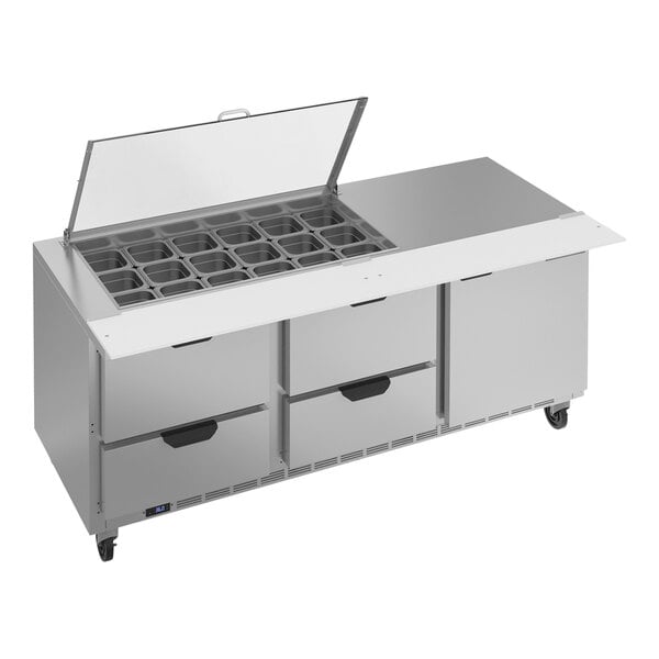 A Beverage-Air stainless steel sandwich prep table with drawers and clear lids.