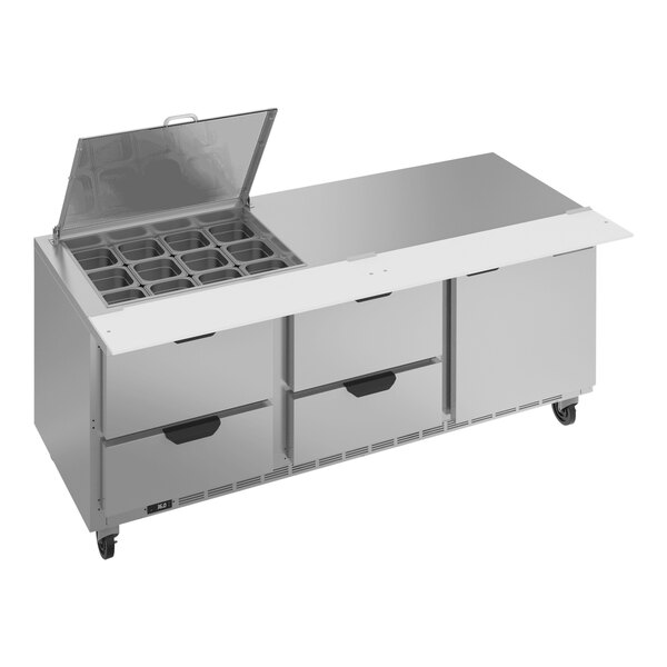 A Beverage-Air stainless steel refrigerated sandwich prep table with clear lids open over drawers.