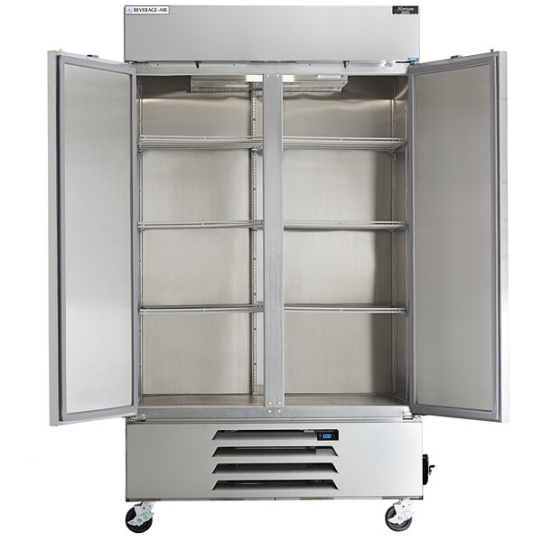 A silver Beverage-Air reach-in freezer with two open doors.