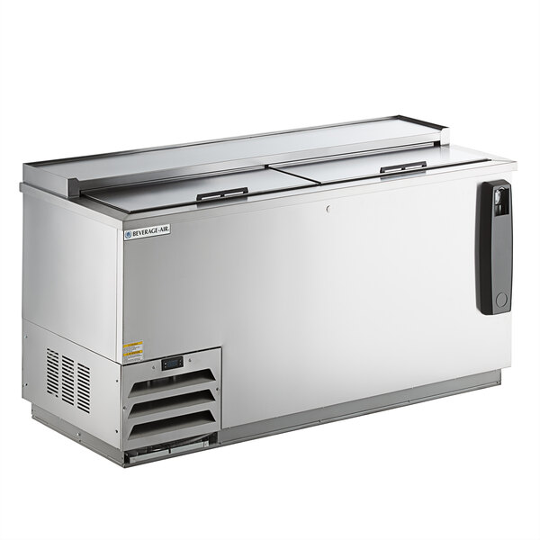 A Beverage-Air stainless steel deep well bottle cooler on a counter with a glass door on top.