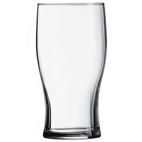 An Arcoroc tulip pub glass filled with beer on a white background.