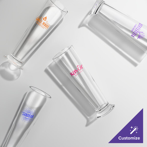 A set of four clear, customizable footed pilsner glasses with different colored logos printed on each.