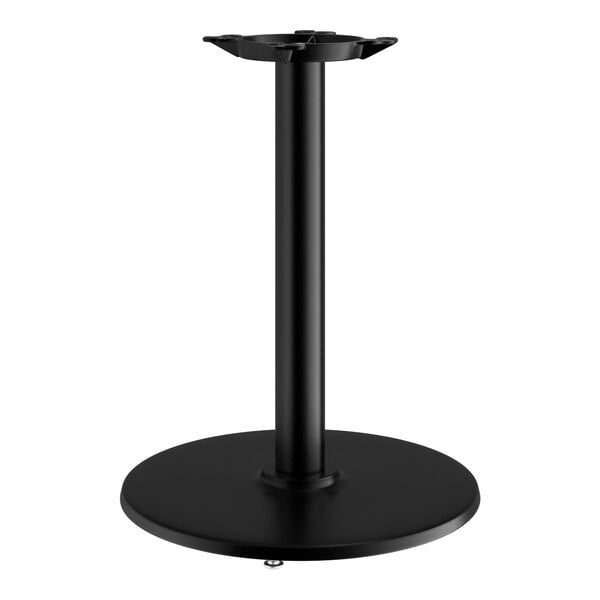 A Lancaster Table & Seating black cast iron round table base with a round pole