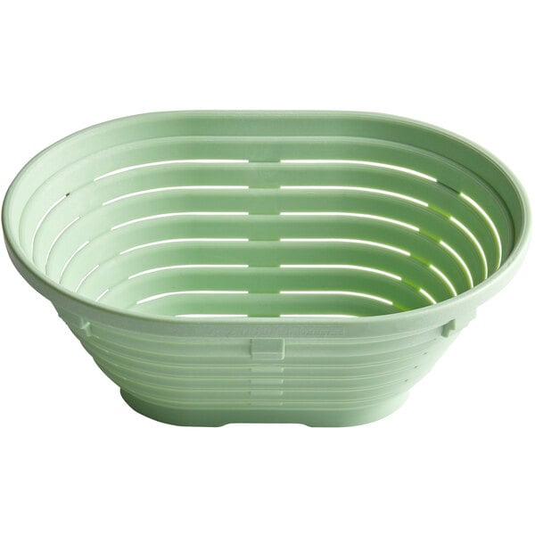 A green plastic Herbert Birnbaum oval bread proofing basket with holes.