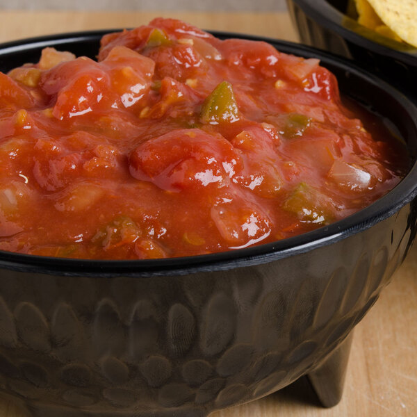 a bowl of salsa and chips