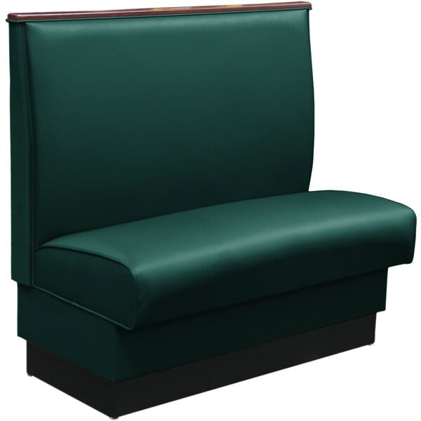 A forest green fully upholstered booth with wood top cap.